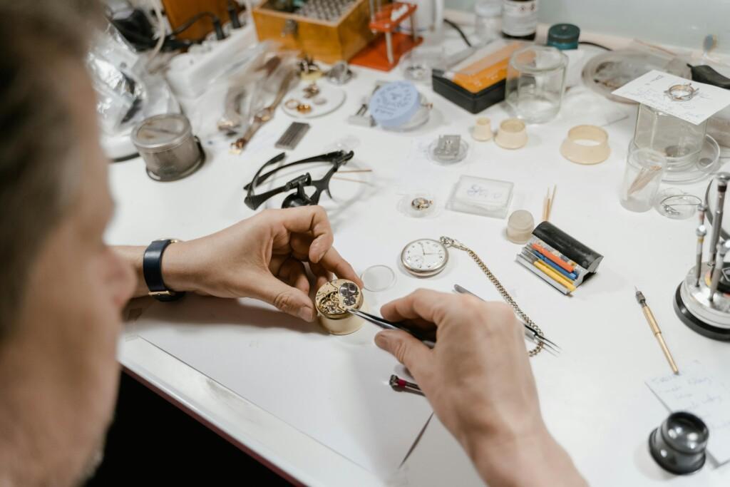 pexels-photo-8327880-8327880 A skilled watchmaker meticulously repairs a vintage watch in a workshop setting.